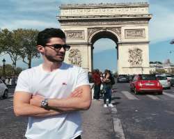 He shared a picture of him standing in front of Arc De Truimphe in his April 2019 post.